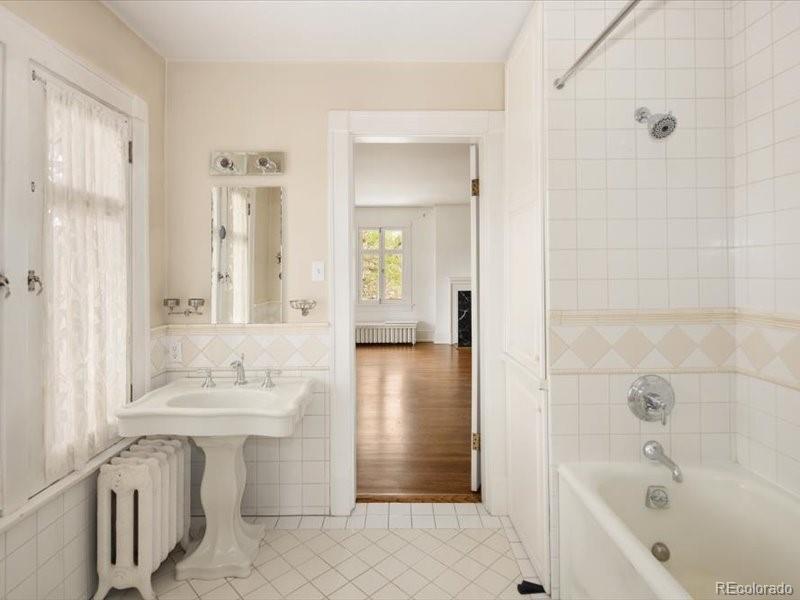 199 Lafayette Street Denver, CO 80218 - Photo 30 of 49 a bathroom with a sink a toilet and shower