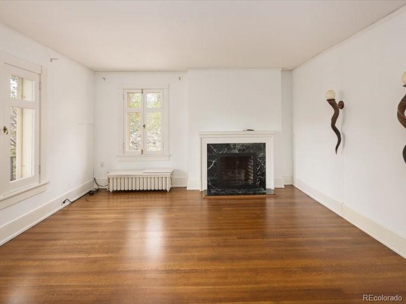199 Lafayette Street Denver, CO 80218 - Photo 31 of 49 an empty room with windows and fireplace
