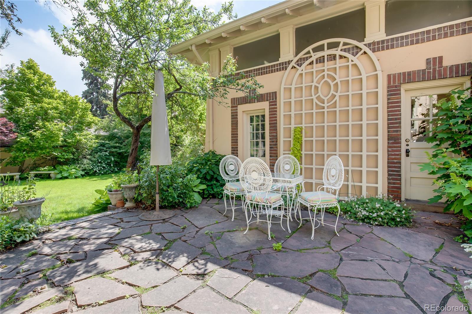 199 Lafayette Street Denver, CO 80218 - Photo 46 of 49 a view of a chair and table in backyard of the house