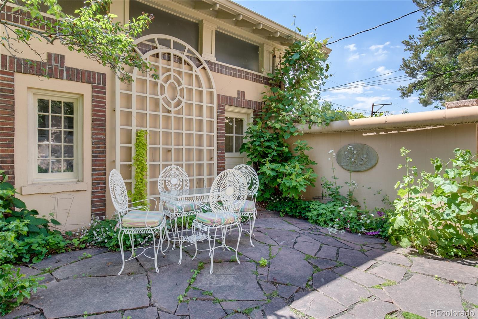 199 Lafayette Street Denver, CO 80218 - Photo 47 of 49 a view of a chairs and table in the back yard of a house