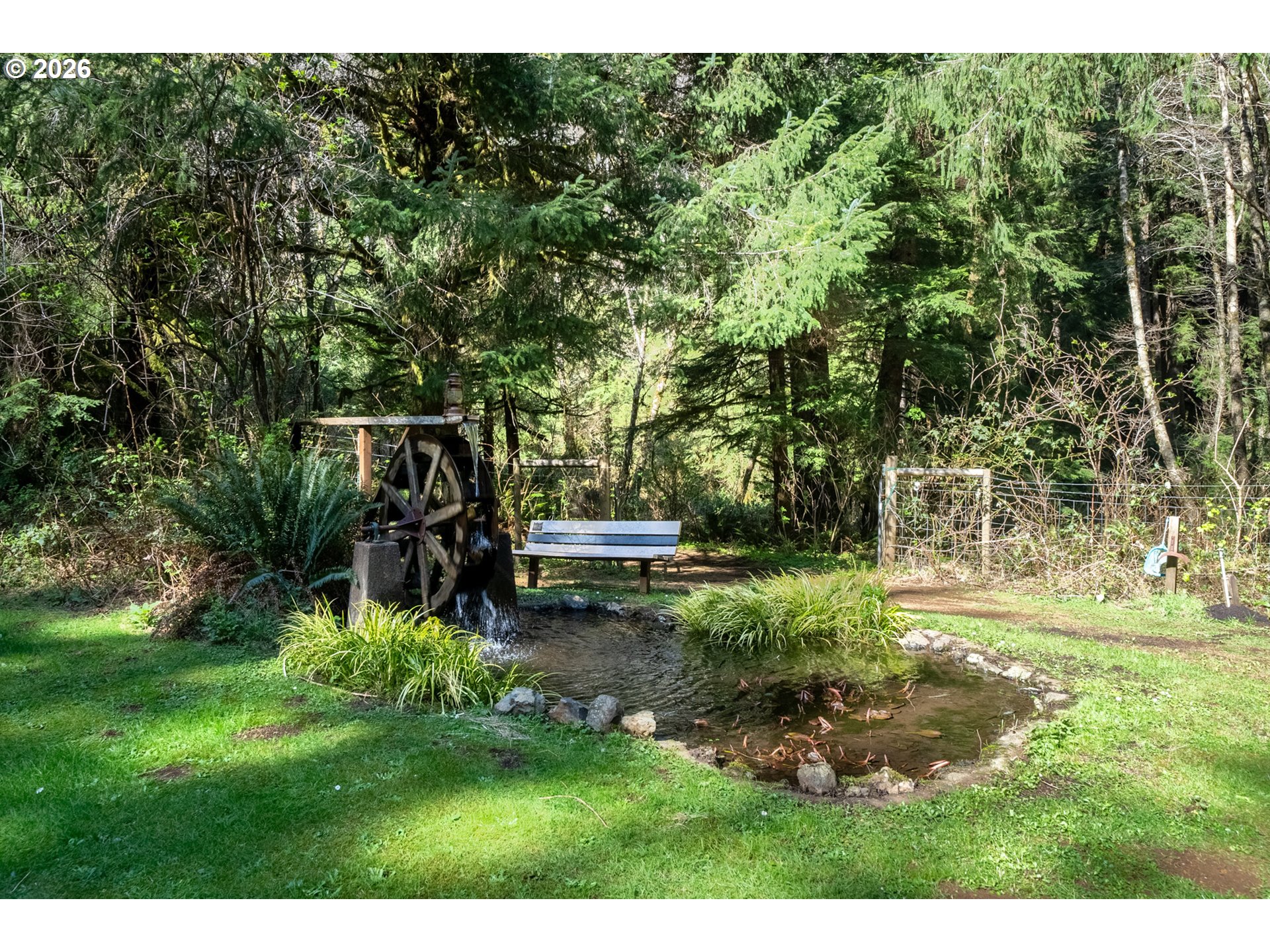 23100 Miami Foley Road Nehalem, OR 97131 - Photo 12 of 47 a backyard of a house with a yard and outdoor seating