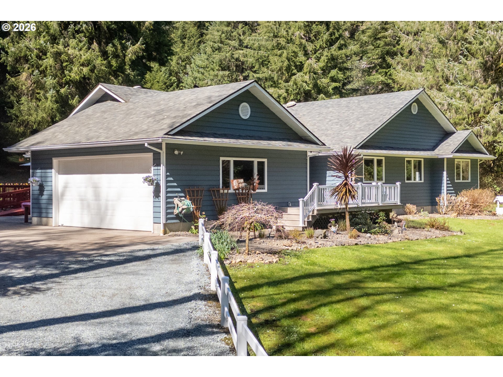 23100 Miami Foley Road Nehalem, OR 97131 - Photo 15 of 47 a view of a house with backyard and sitting area