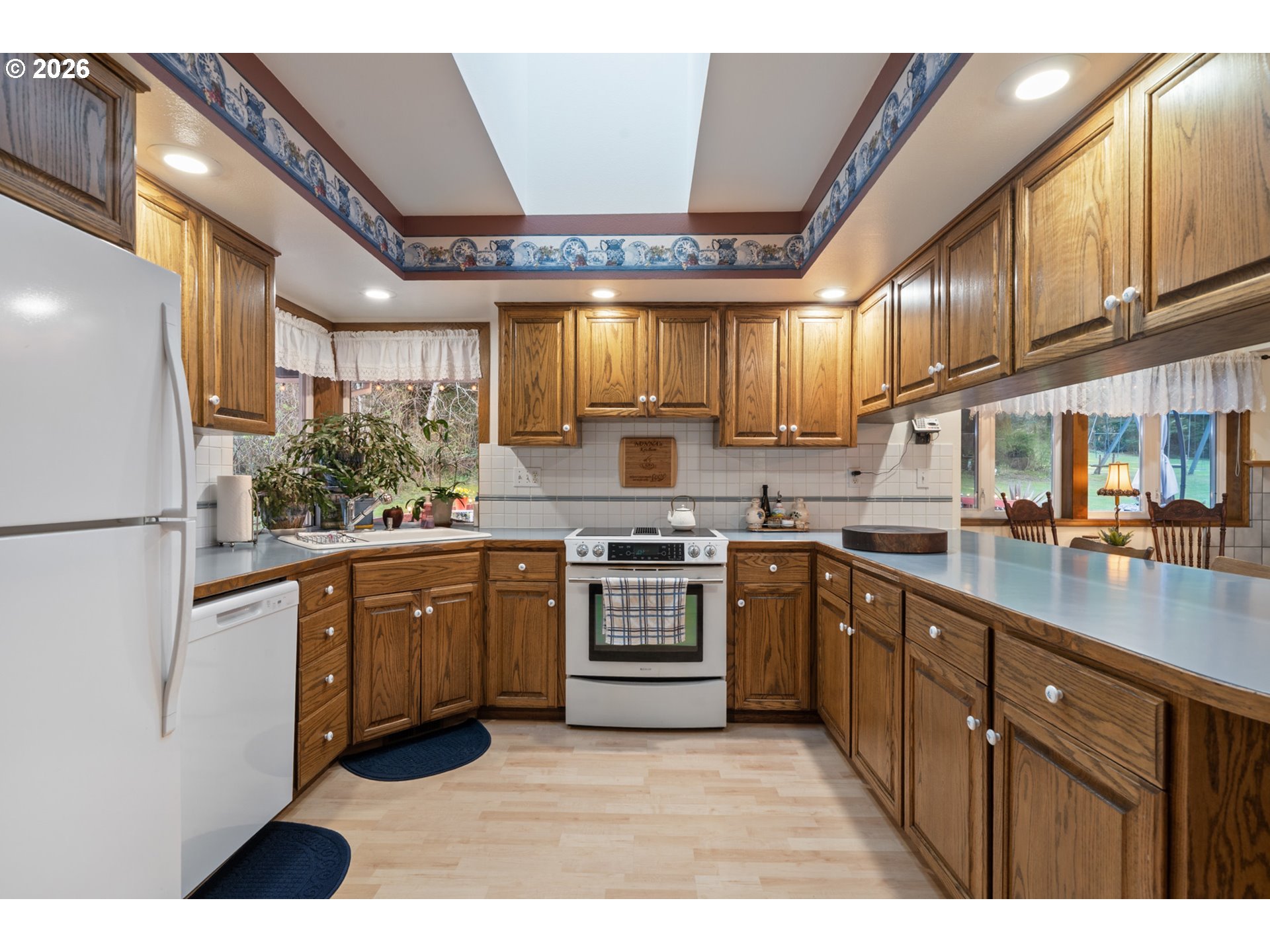 23100 Miami Foley Road Nehalem, OR 97131 - Photo 20 of 47 a kitchen with stainless steel appliances granite countertop a stove a sink dishwasher and a refrigerator