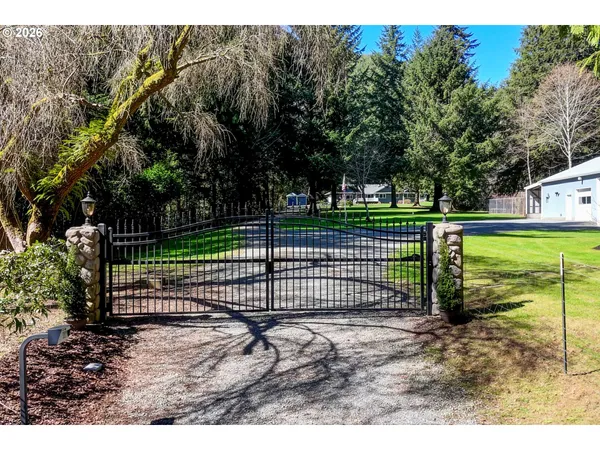 a view of a backyard with a fence