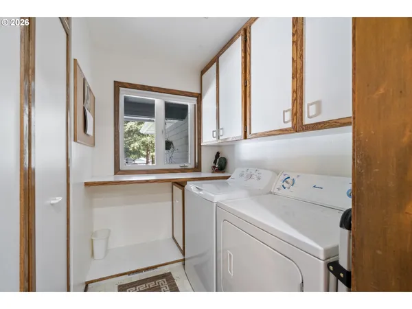 a bathroom with a sink and a window