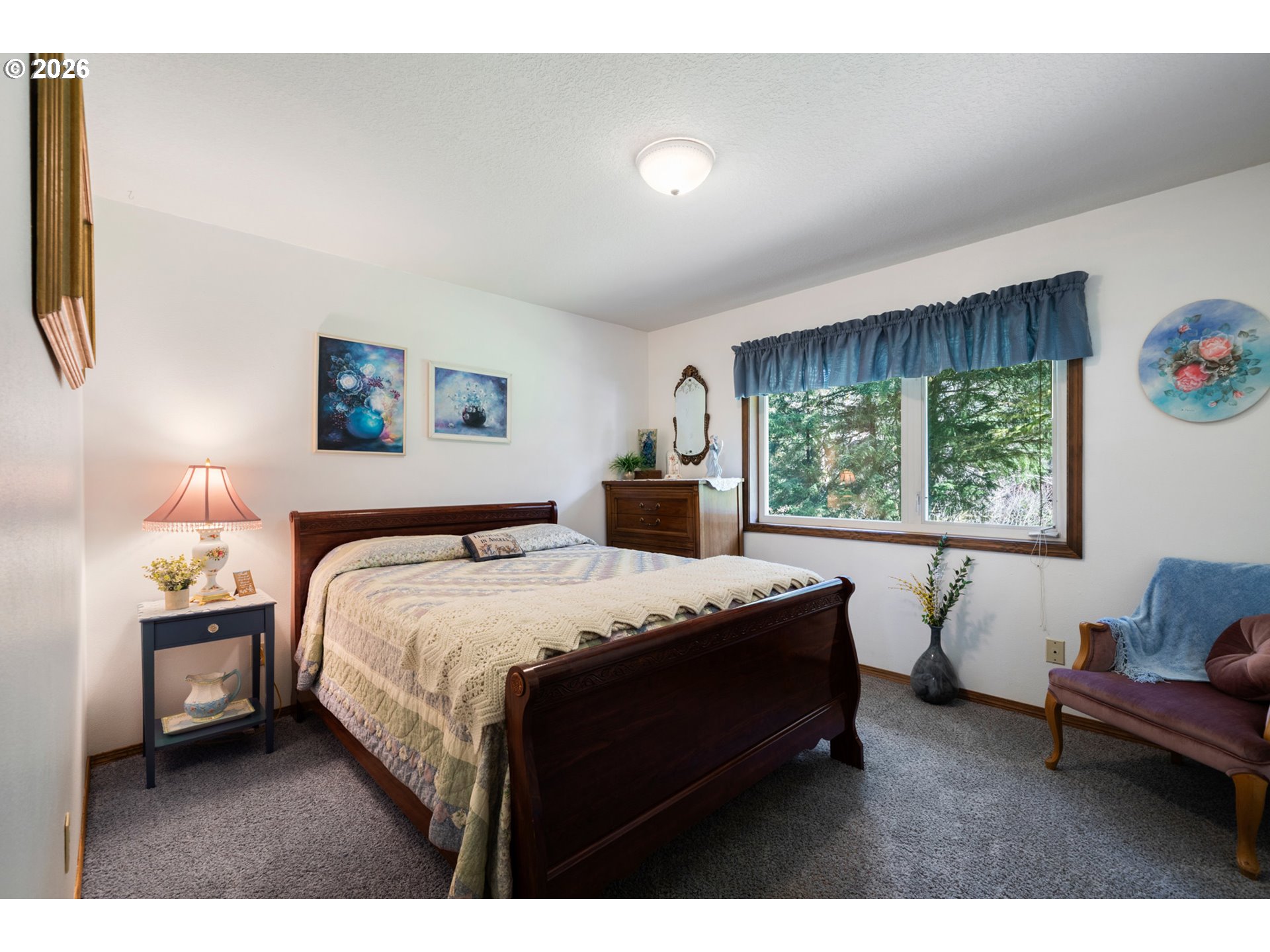 23100 Miami Foley Road Nehalem, OR 97131 - Photo 28 of 47 a bedroom with a bed window and couch