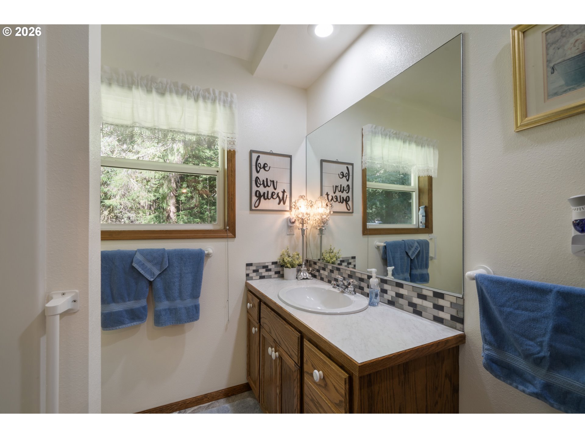 23100 Miami Foley Road Nehalem, OR 97131 - Photo 30 of 47 a bathroom with a sink vanity and a mirror