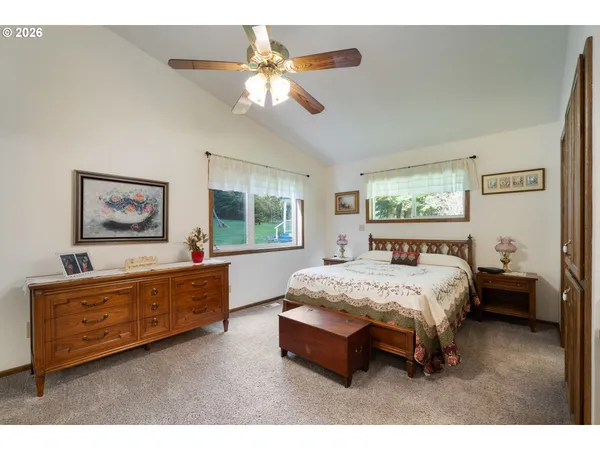 a bed room with a bed and a chandelier
