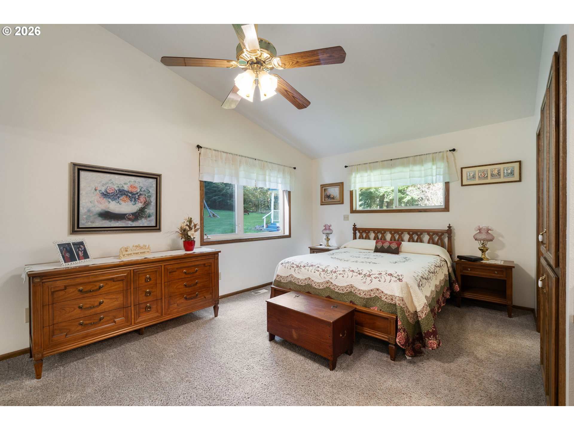 23100 Miami Foley Road Nehalem, OR 97131 - Photo 32 of 47 a bed room with a bed and a chandelier
