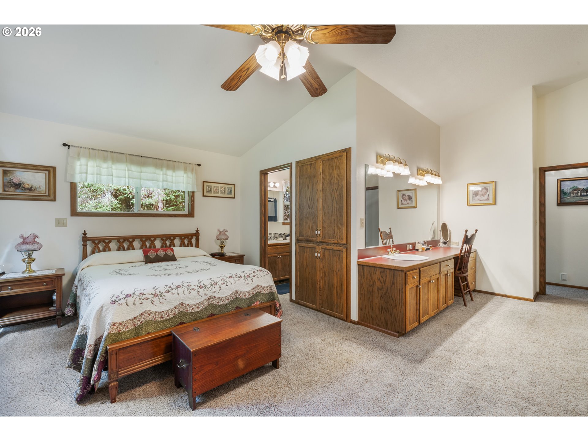 23100 Miami Foley Road Nehalem, OR 97131 - Photo 33 of 47 a bedroom with a bed and a chandelier