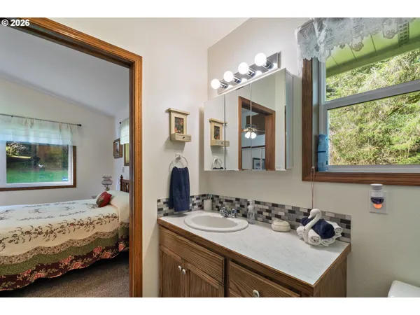 a bedroom with a bed and a mirror