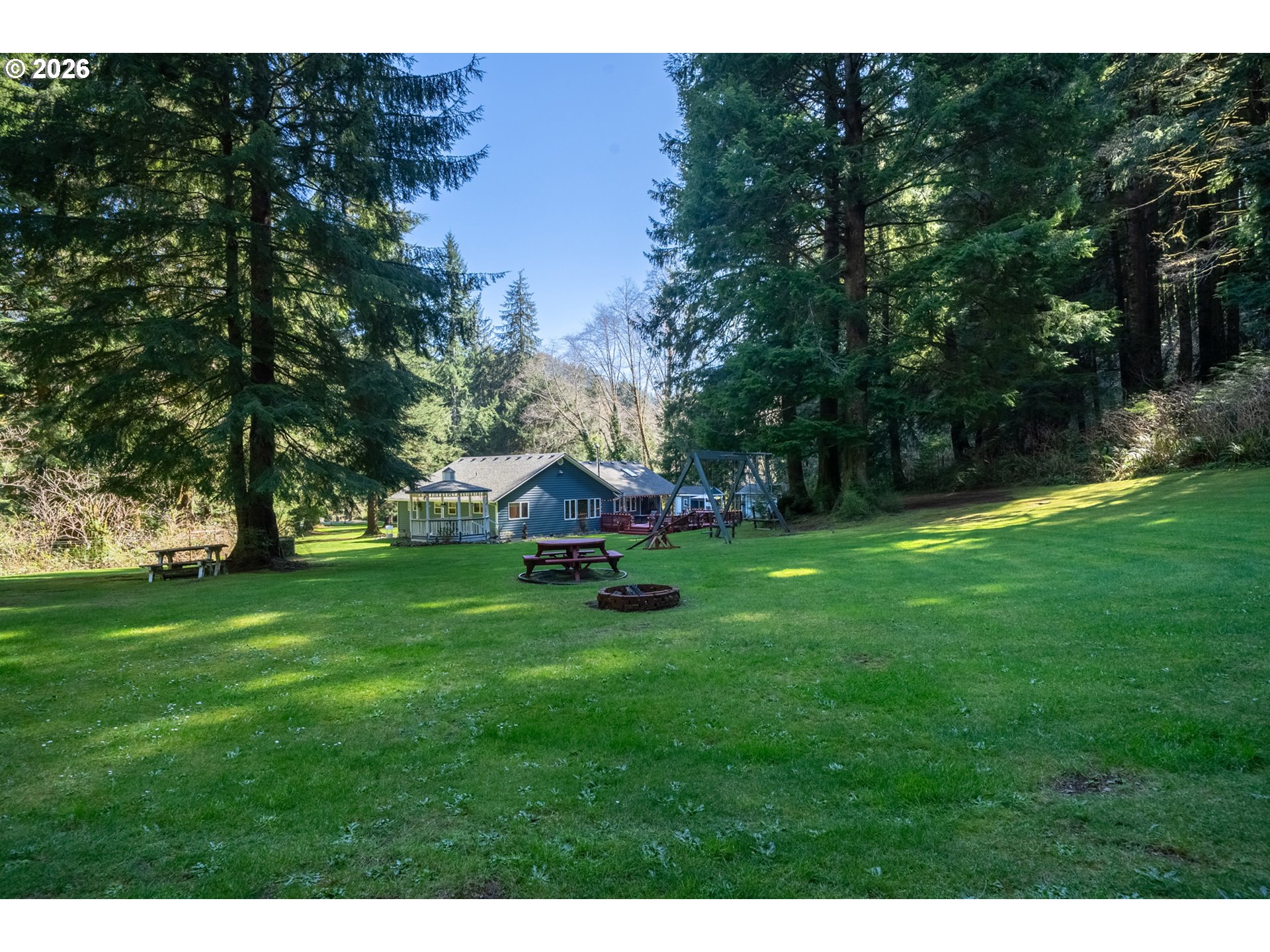 23100 Miami Foley Road Nehalem, OR 97131 - Photo 5 of 47 a view of a backyard with a garden and entertaining space