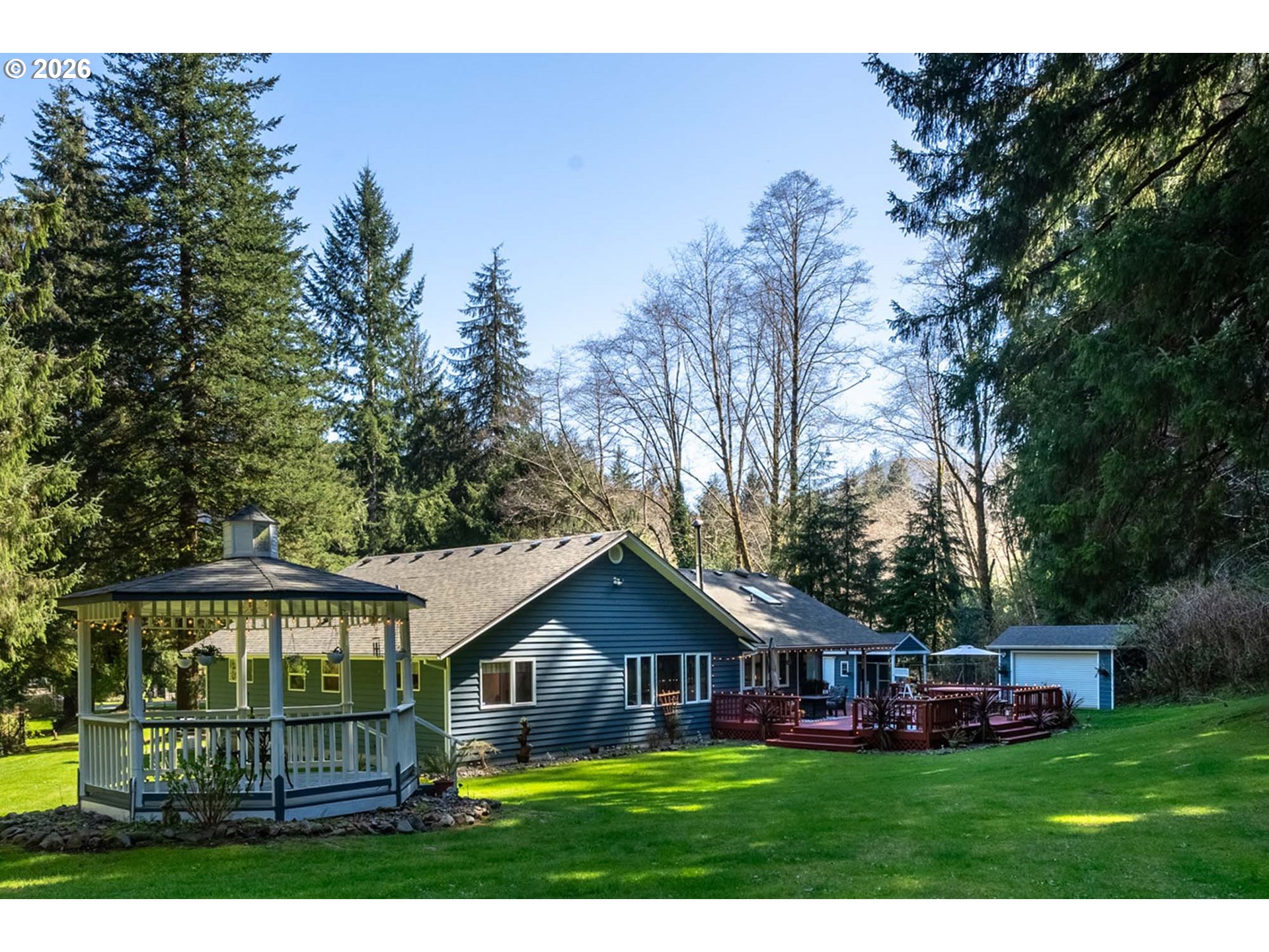 23100 Miami Foley Road Nehalem, OR 97131 - Photo 6 of 47 a front view of a house with garden