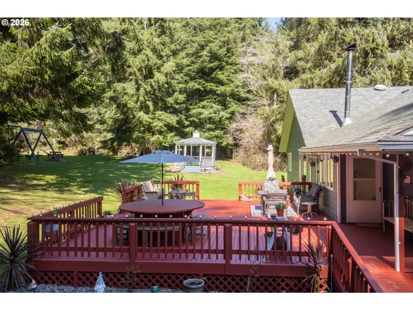 a view of a chairs and table in the balcony