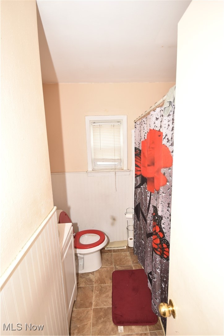 5840 Turney Road Cleveland, OH 44125 - Photo 11 of 21 Bathroom featuring tile patterned floors, toilet, and vanity