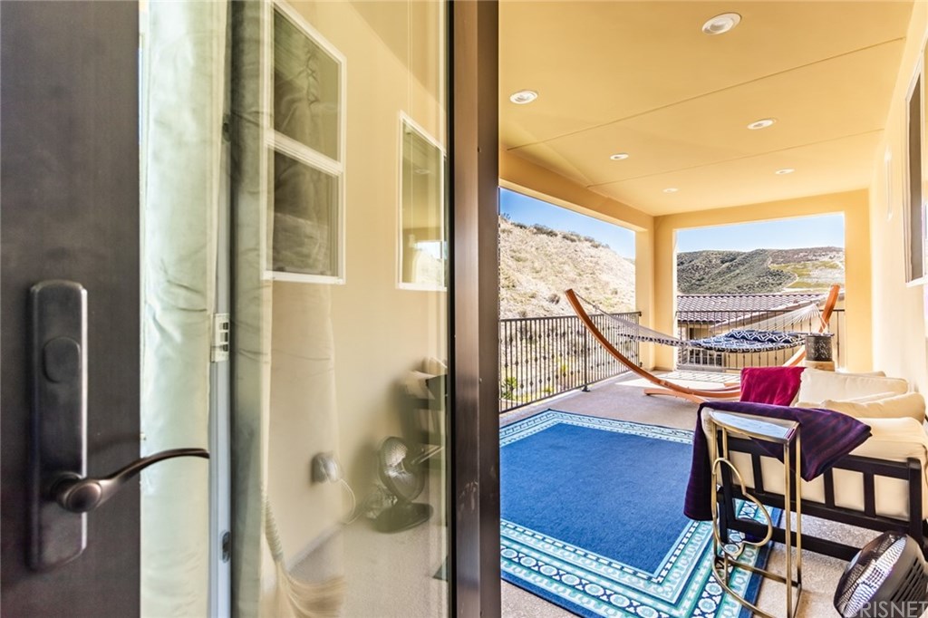 19047 Bension Drive Saugus, CA 91350 - Photo 35 of 72 Primary suite covered deck with recessed lighting and tranquil views.