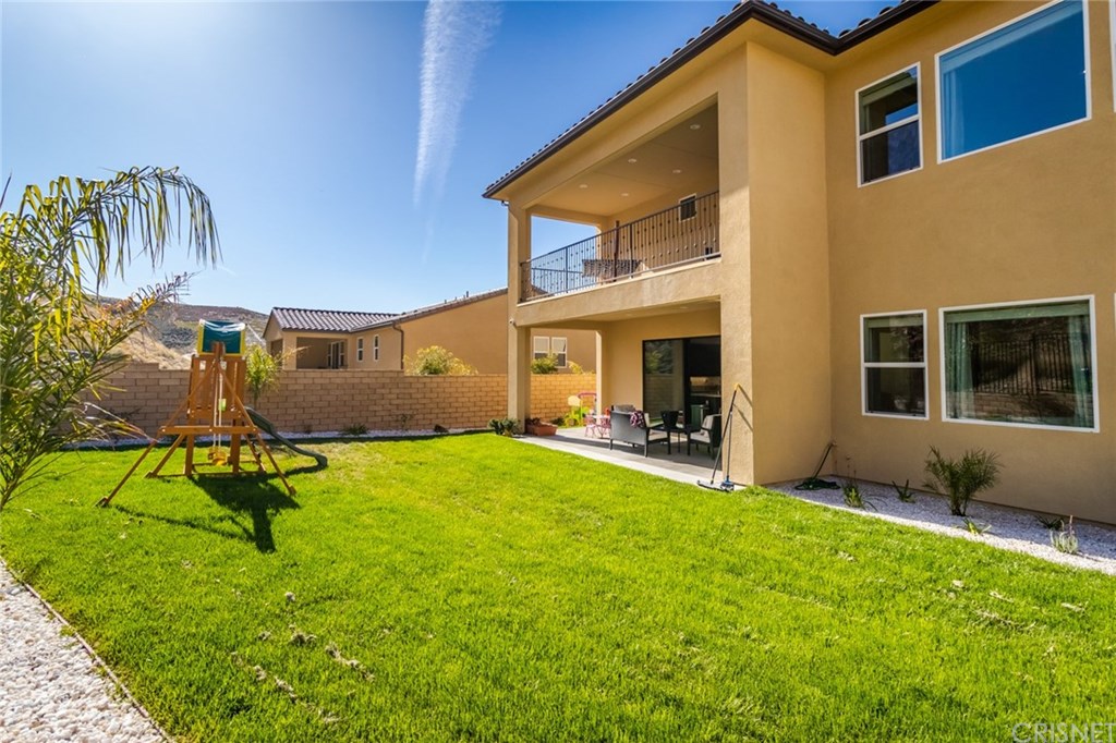 19047 Bension Drive Saugus, CA 91350 - Photo 64 of 72 View from backyard of covered patio and primary suite's covered deck.