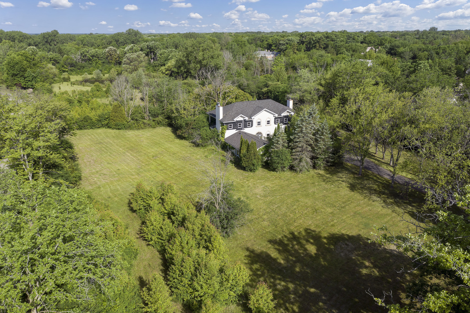 3000 Telegraph Road Bannockburn, IL 60015 - Photo 6 of 18 a view of a yard with a plants and trees