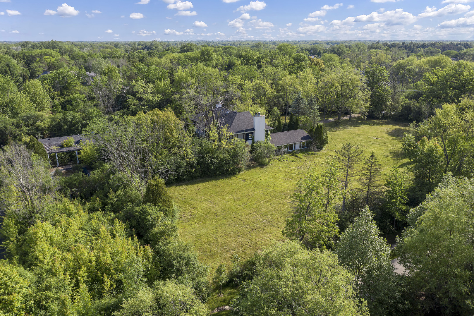3000 Telegraph Road Bannockburn, IL 60015 - Photo 7 of 18 a view of a garden with a building in the background