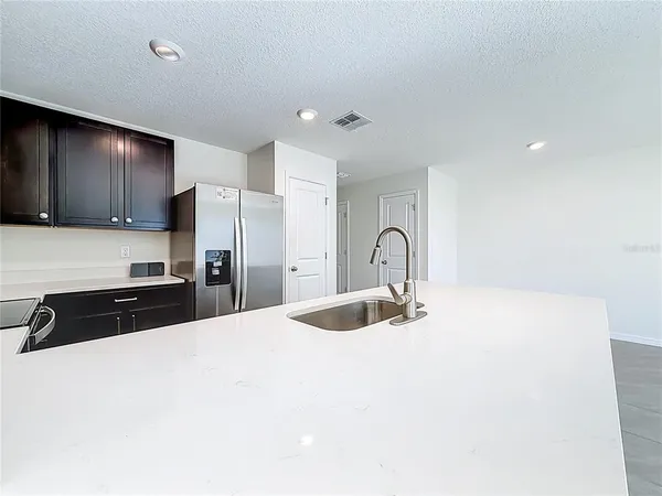 a view of a kitchen with a sink