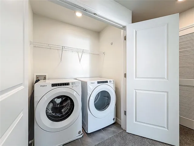 a view of a balcony with outdoor seating