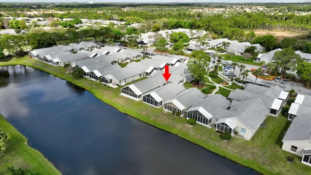 an aerial view of multiple houses with a yard