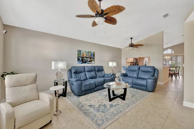 a living room with couches and a coffee table
