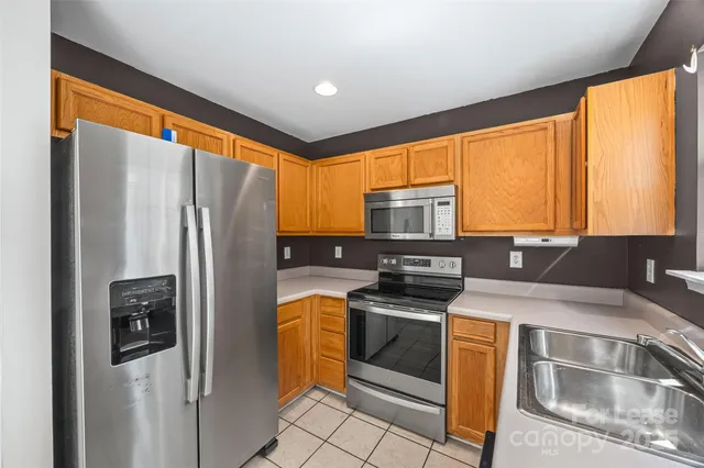 a kitchen with a sink cabinets and window