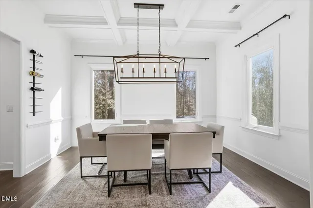 a bed room with a bed window and a chair