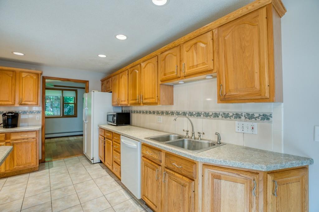 38 Berwick Road Longmeadow, MA 01106 - Photo 11 of 33 a kitchen with stainless steel appliances granite countertop a sink stove and cabinets