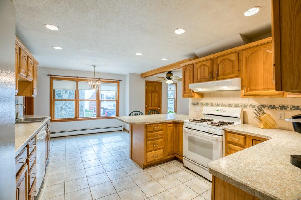 38 Berwick Road Longmeadow, MA 01106 - Photo 12 of 33 a kitchen with a stove a sink and a refrigerator