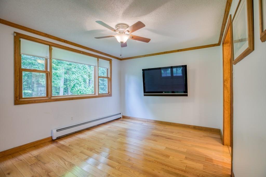 38 Berwick Road Longmeadow, MA 01106 - Photo 16 of 33 a view of an empty room with a window and wooden floor