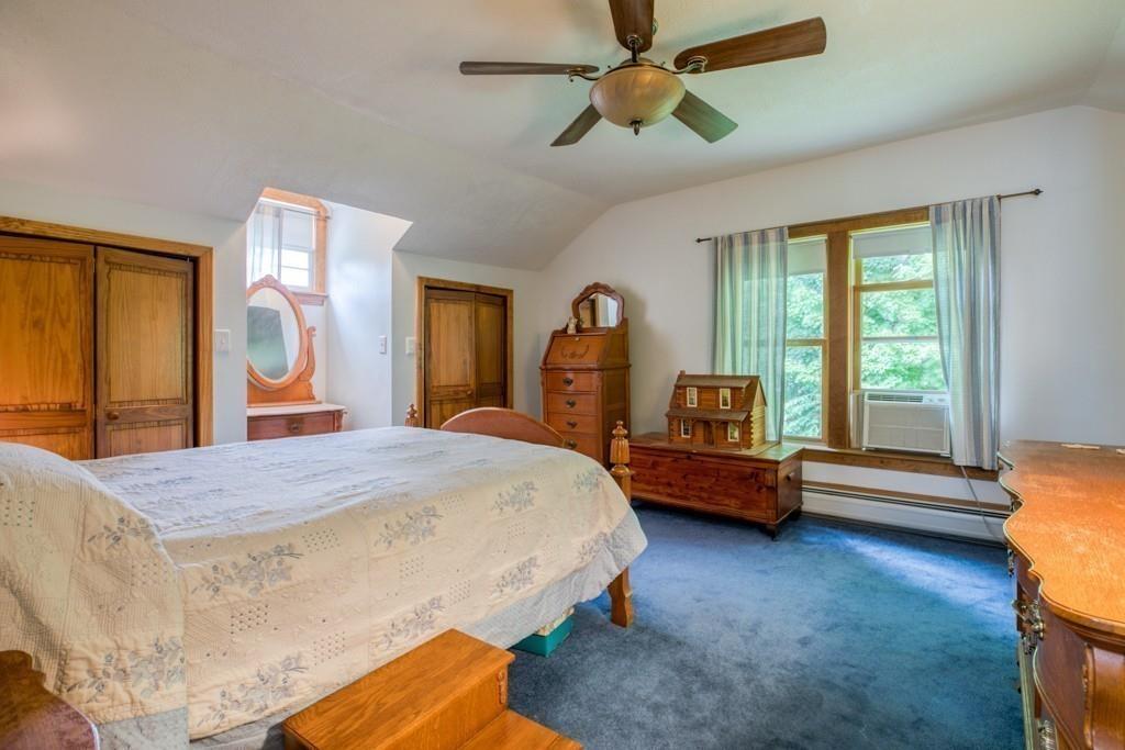 38 Berwick Road Longmeadow, MA 01106 - Photo 25 of 33 a bedroom with a bed mirror and a window