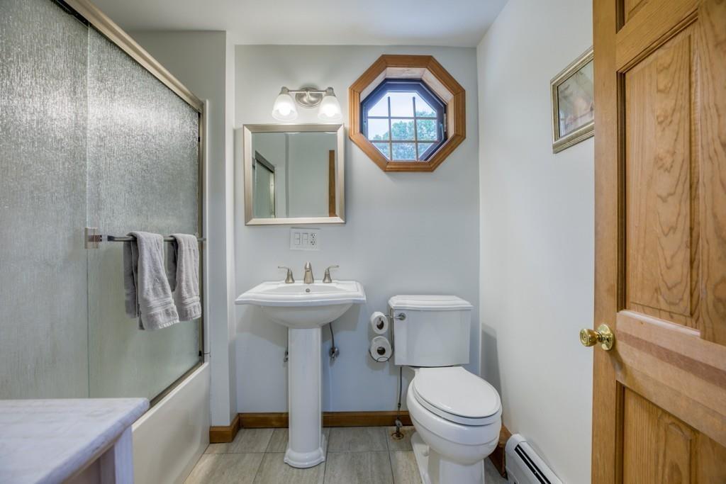 38 Berwick Road Longmeadow, MA 01106 - Photo 28 of 33 a bathroom with a toilet sink and mirror