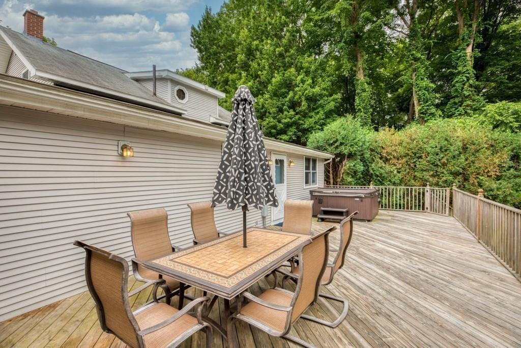 38 Berwick Road Longmeadow, MA 01106 - Photo 31 of 33 a roof deck with a dining table and chairs with wooden floor