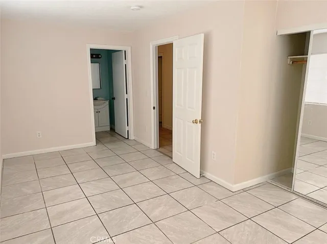 a view of an empty room and cabinet