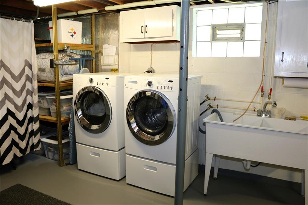 3517 Bevan Road North Versailles, PA 15137 - Photo 20 of 25 Large laundry room with double utility sink, washer/dryer and plenty of storage