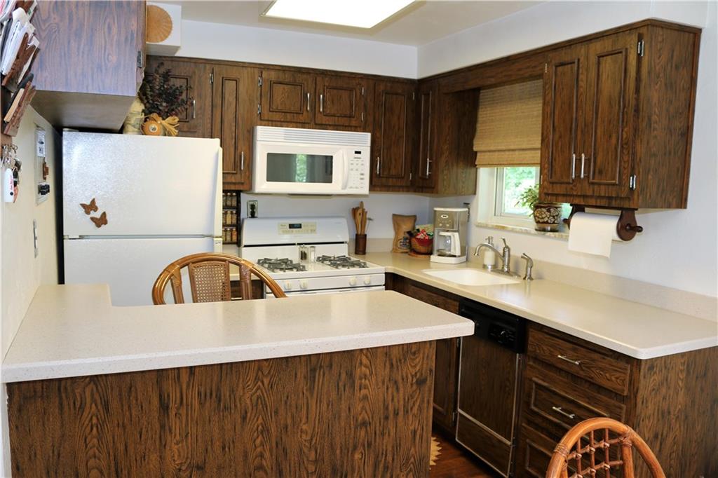 3517 Bevan Road North Versailles, PA 15137 - Photo 6 of 25 Eat-in kitchen with custom cabinetry and corian counter tops with all appliances included