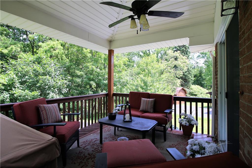 3517 Bevan Road North Versailles, PA 15137 - Photo 9 of 25 Outdoor oasis deck with ceiling fan and private wooded views