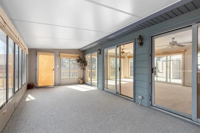 a view of empty room with floor to ceiling window