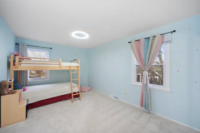 a view of room with window and ceiling fan