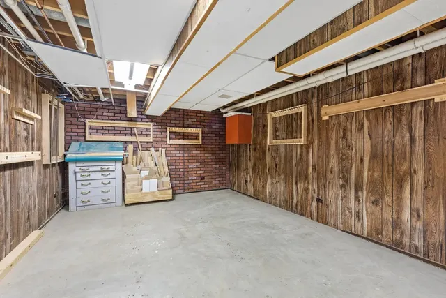 a front view of a house with a yard table and chairs