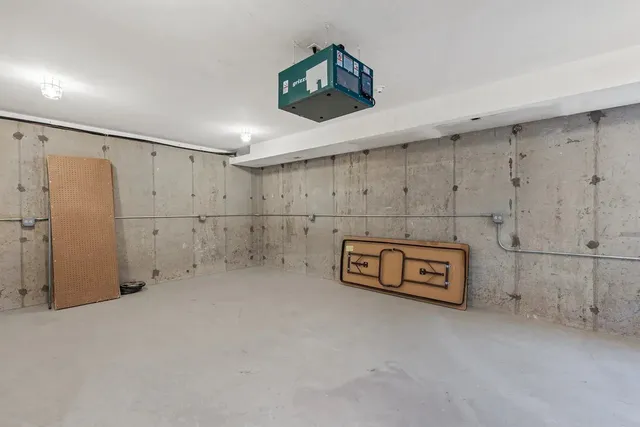 a front view of a house with a yard porch and wooden fence