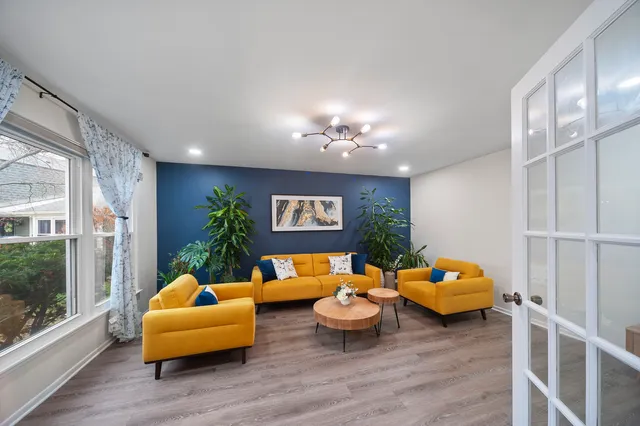 a living room with furniture and a large window