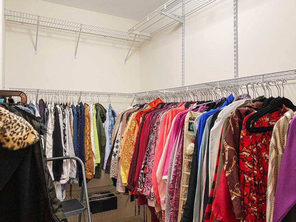 598 Ansley Circle Northeast Atlanta, GA 30324 - Photo 15 of 24 a view of walk in closet with clothes and shoes