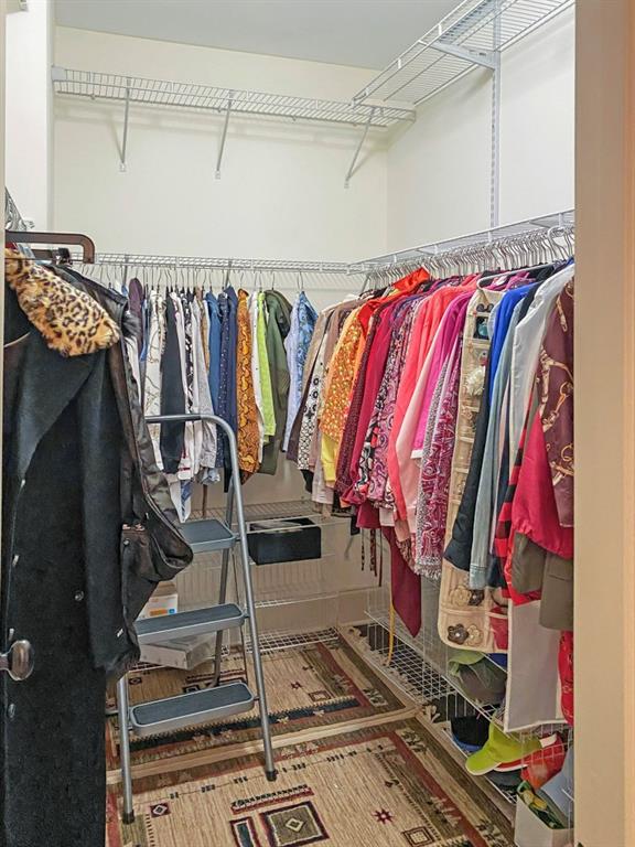 598 Ansley Circle Northeast Atlanta, GA 30324 - Photo 16 of 24 a view of walk in closet with clothes