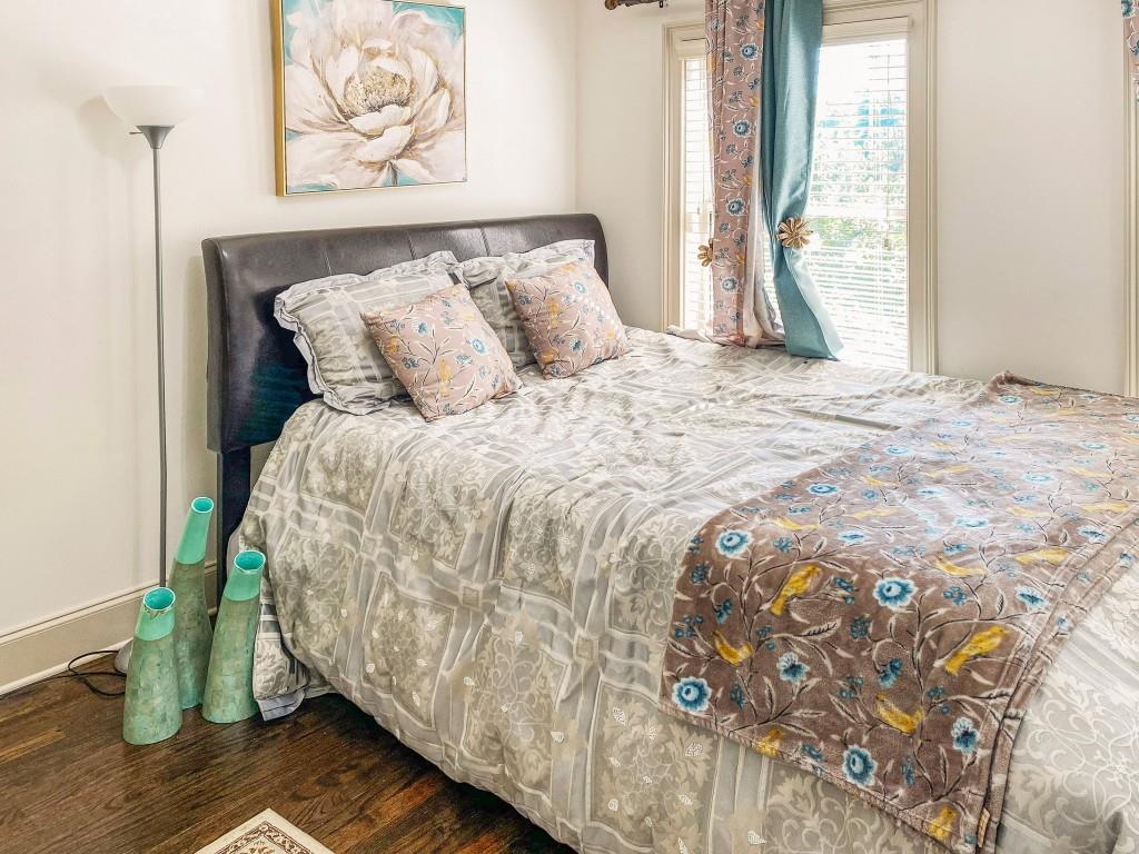 598 Ansley Circle Northeast Atlanta, GA 30324 - Photo 18 of 24 a bed sitting in a bedroom next to a window