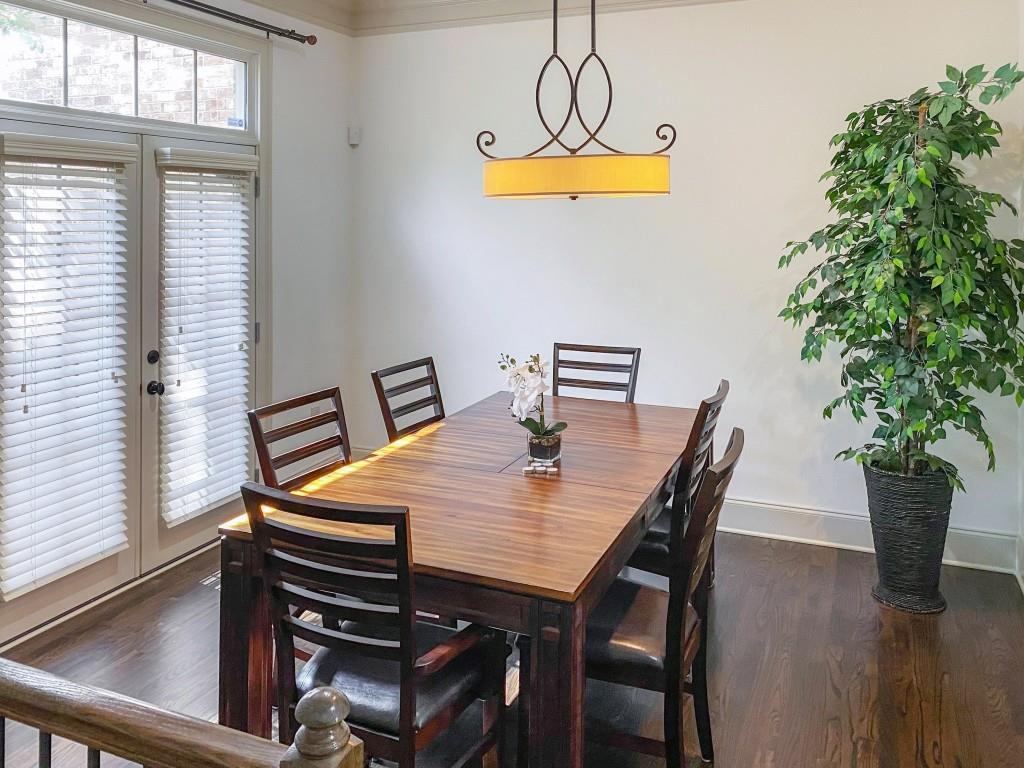 598 Ansley Circle Northeast Atlanta, GA 30324 - Photo 5 of 24 a view of a dining room with furniture window and wooden floor