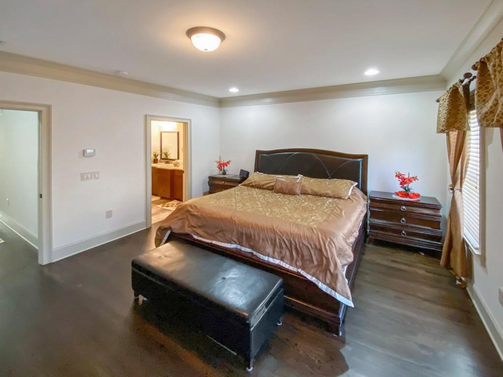 598 Ansley Circle Northeast Atlanta, GA 30324 - Photo 8 of 24 a bedroom with a bed and a window