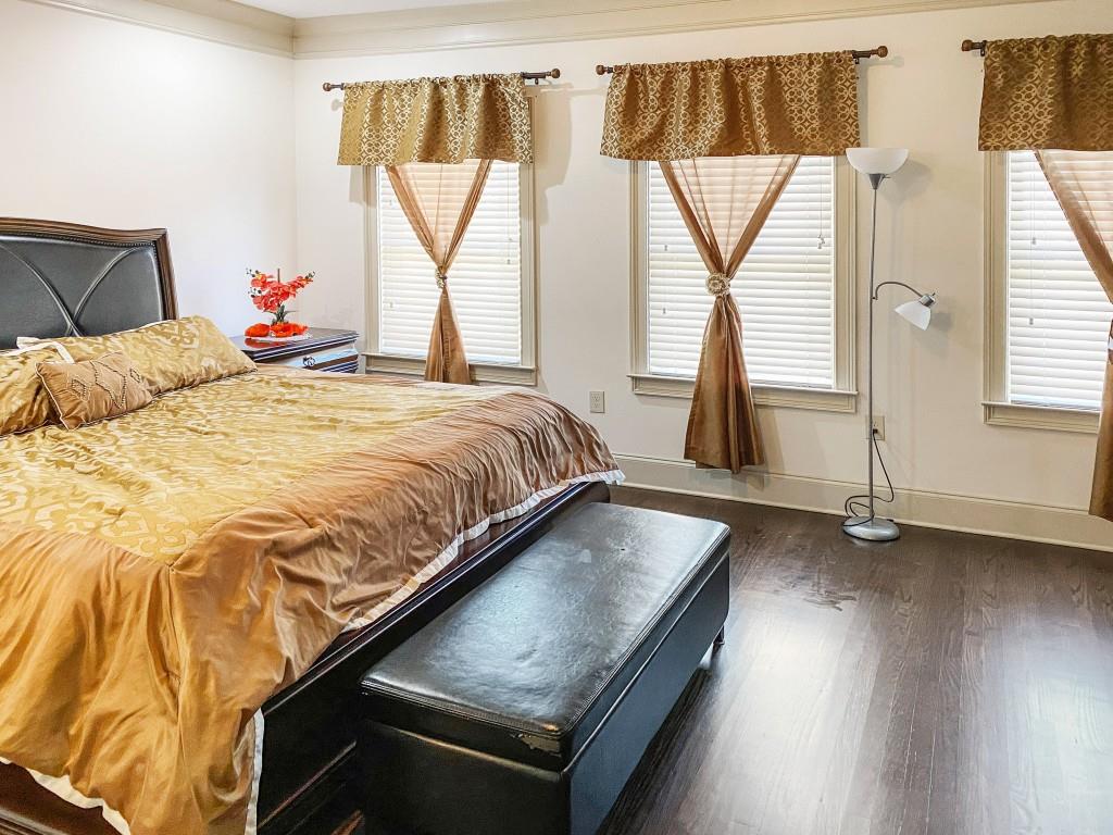 598 Ansley Circle Northeast Atlanta, GA 30324 - Photo 10 of 24 a bedroom with a bed and a window